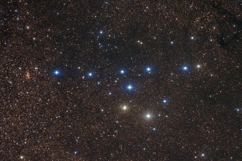 Coathanger cluster: 6 stars in line with 4 stars making hook below them against crisp star field.