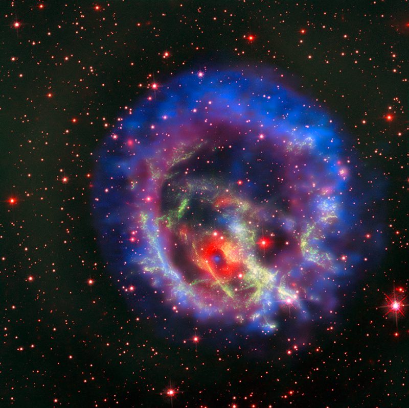 Colorful round explosion remnants floating in a starry sky.