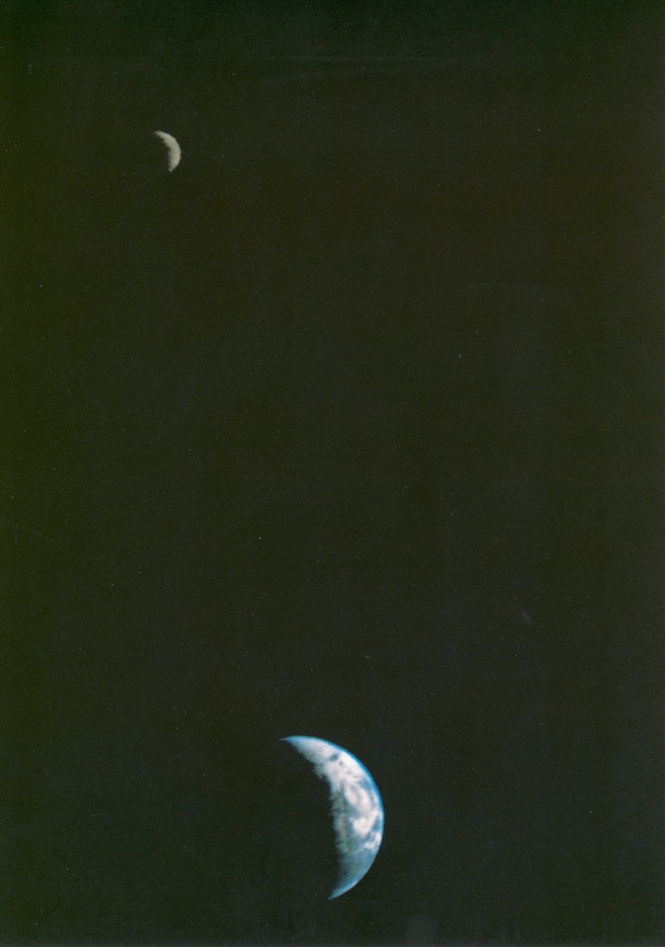 Voyager 1 image of Earth and moon in space.