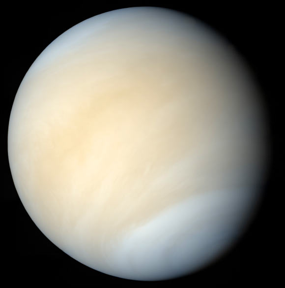 Pale yellow cloud-covered planet.