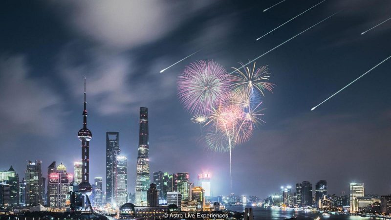 Fireworks over Shanghai, China, with artificial meteors in the sky.