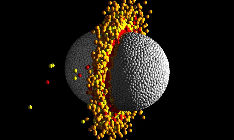 Two hemispheres colliding flat sides together with colored dots spraying out.