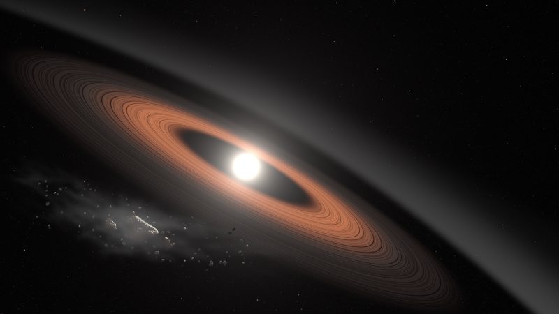 Small, shining white dwarf star with several encircling rings.