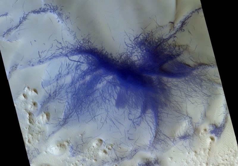 Spider-like burst of many dust devil tracks.