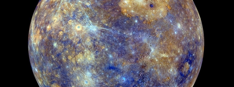 Mostly yellowish and blue blotchy planet with craters and their rays.