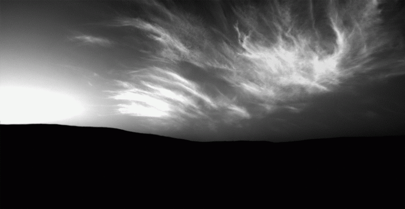 Feathery clouds on Mars in white on gray.