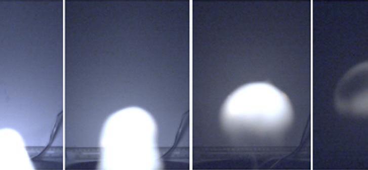 Series of images showing bright balls of light ascending.