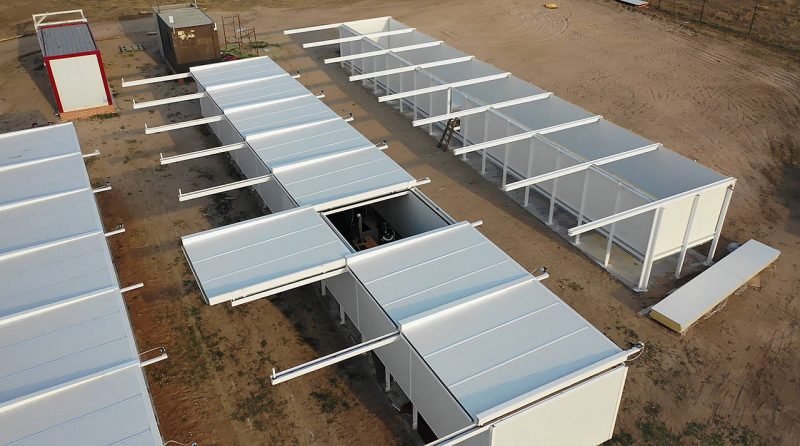 Rows of connected white boxes with square rods sticking out from between them.