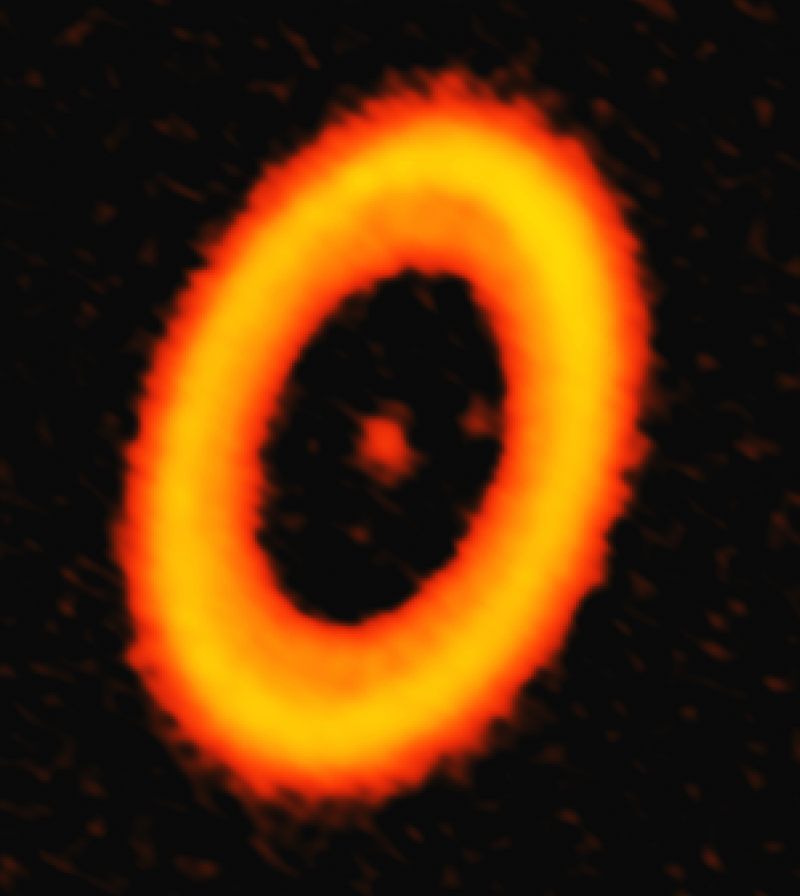 Thick bright ring around an orange dot in the middle and two faint dots inside ring also.