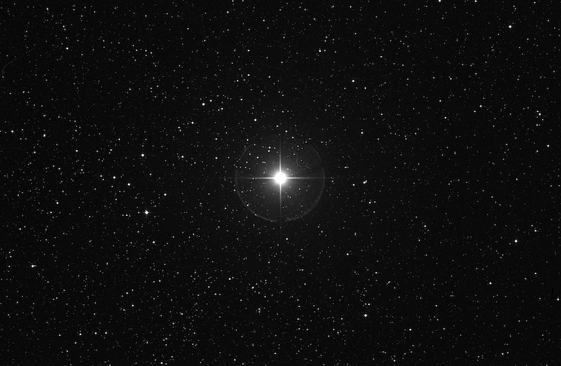 Alpha Cephei: A bright white star in a field of very many fainter stars against a black backdrop.