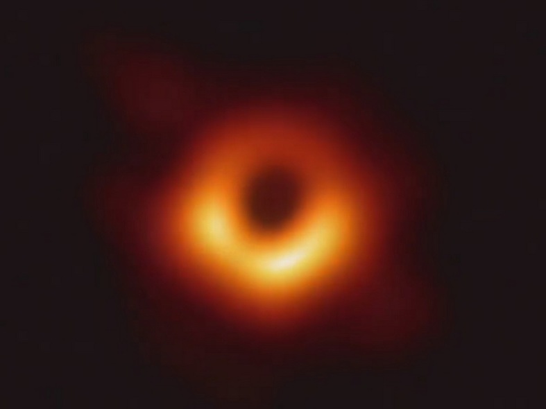 Glowing orange and yellow ring around a black central circular area.