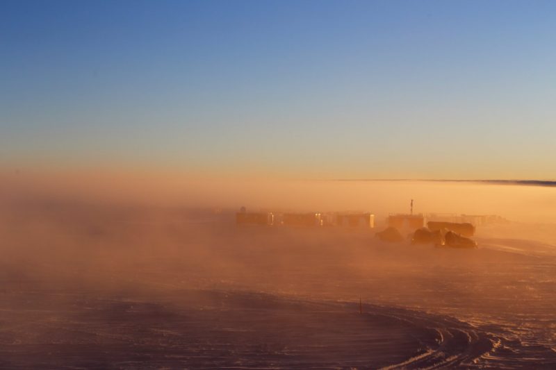 Brown-yellow mist, blue sky.