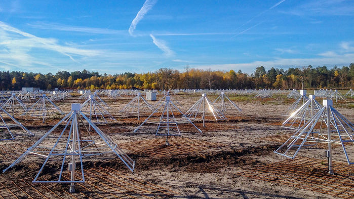 Array of many pyramid-like metal frameworks in a field.