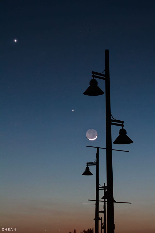 Moon and planets Venus and Jupiter at dusk.