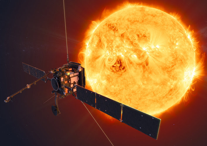 Spacecraft with wide solar panels and several long wire-like antennas, with large sun beyond.