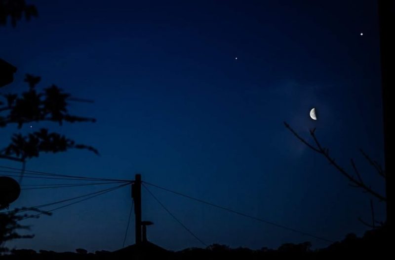 3 planets, crescent moon in deep blue sky above telephone lines before sunup on April 15.