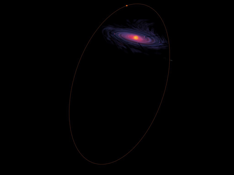 Large thin ring around a bluish spiral on black background.