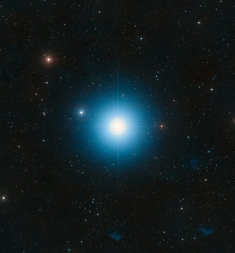 Very bright bluish star with many more stars in background.