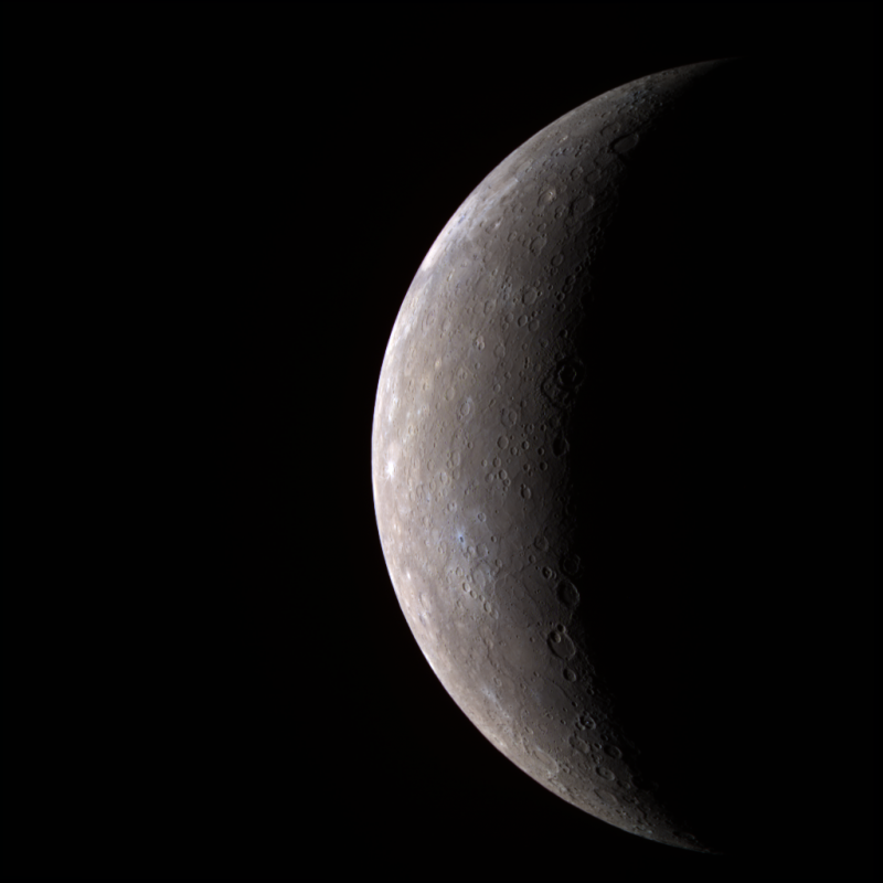 Crescent gray planet with smooth surface marked with shallow craters.