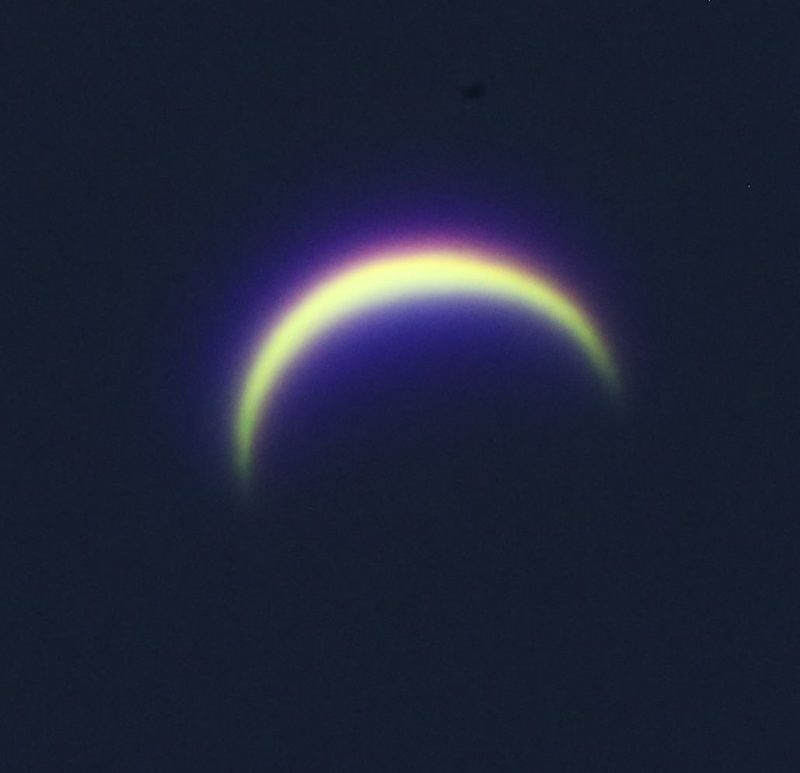 Colorful crescent on black background.