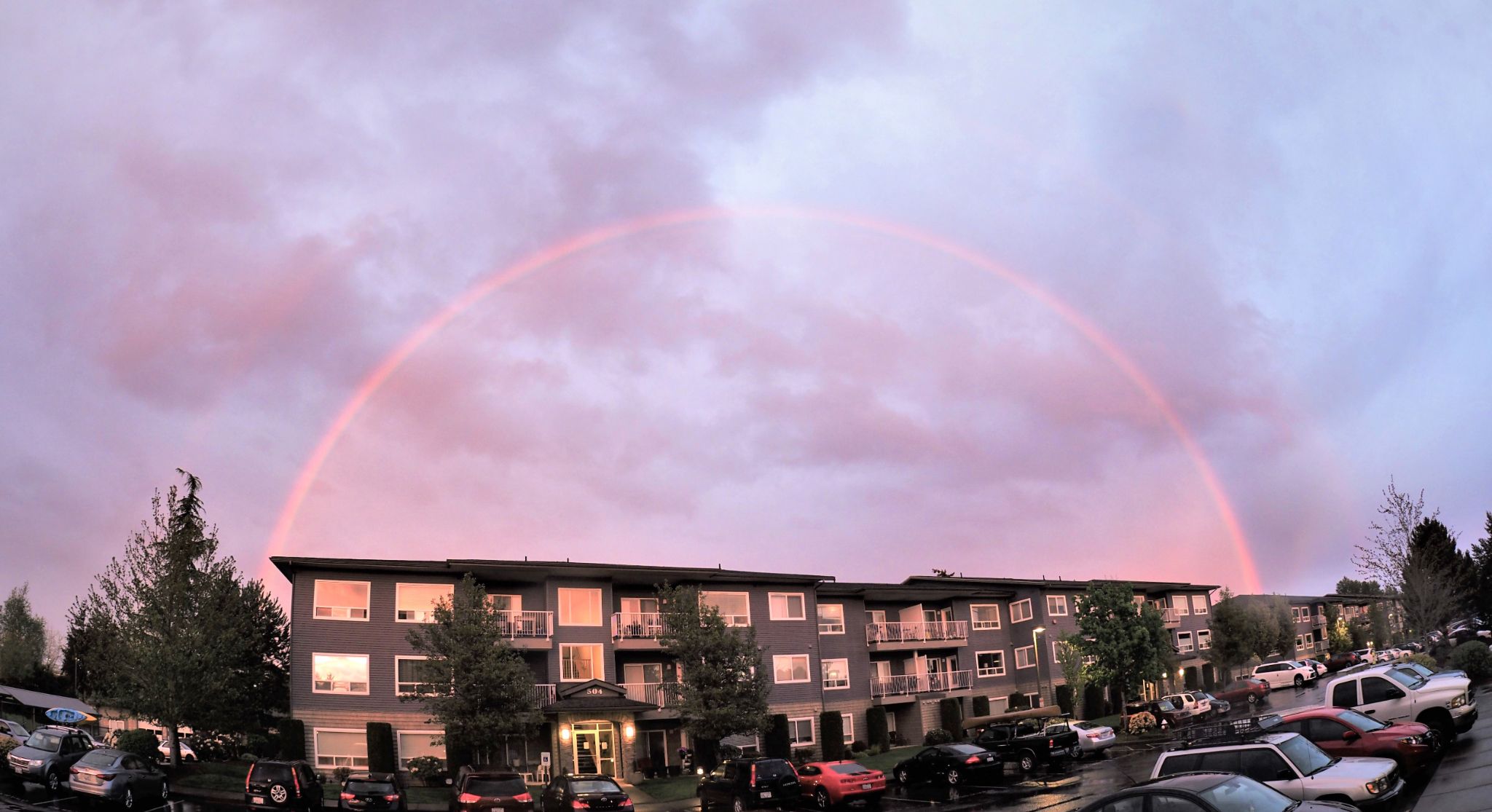 Double rainbow over what looks like an apartment complex.