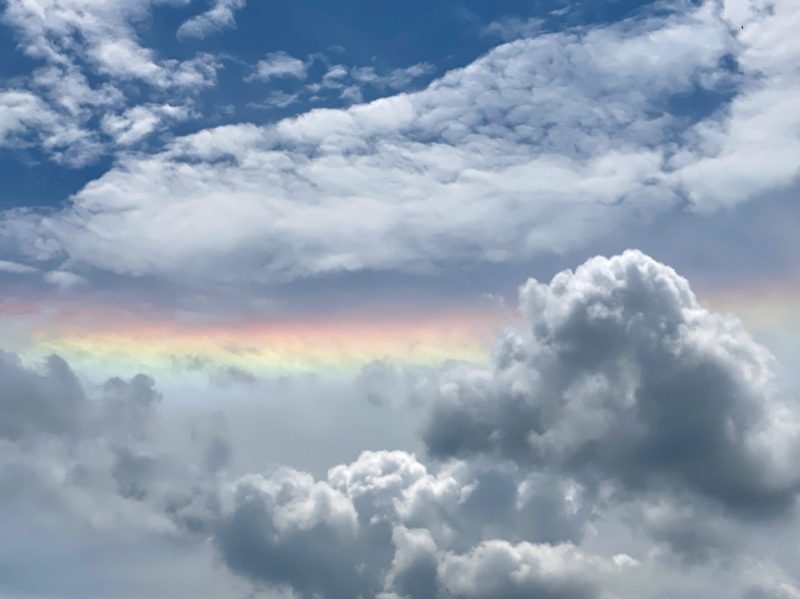 Rainbow stripe among clouds.