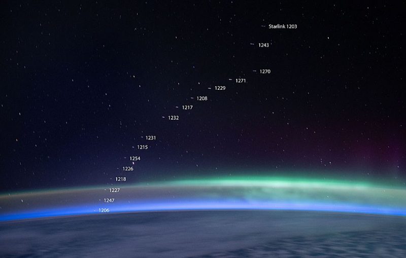 The curve of the Earth as seen from orbit, with 16 tiny streaks (Starlink satellites), each labeled with a number.