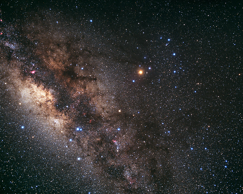 Dense star field with bright stars including red Antares and the stinger stars.