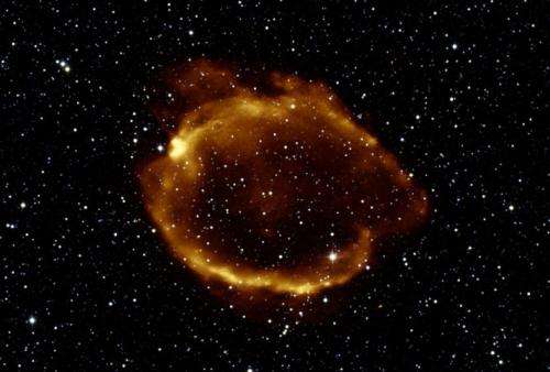 Reddish ring with many stars in background.