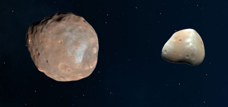 2 irregular rocky objects, 1 twice the apparent size of the other, next to each other on black background with stars.