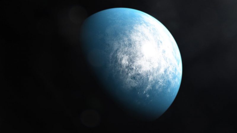 Bluish planet with white clouds in black space.