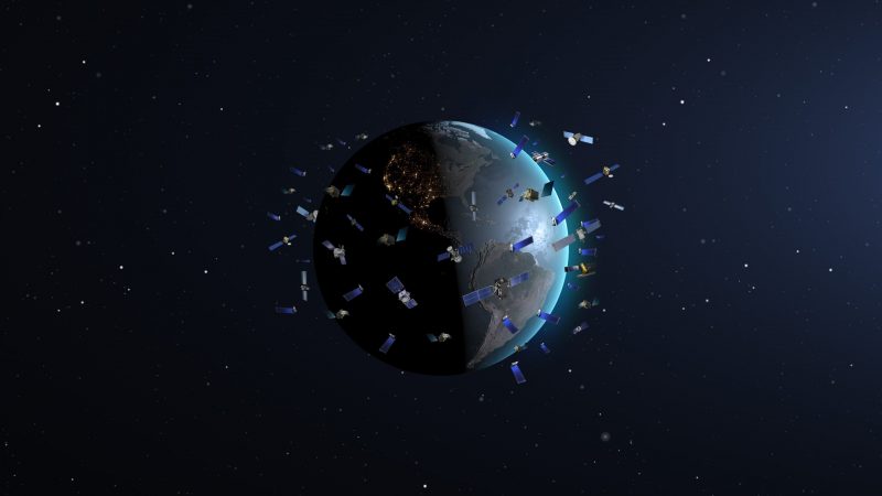 Illustration of Earth in space, surrounded by confetti-like halo of very many orbiting objects.