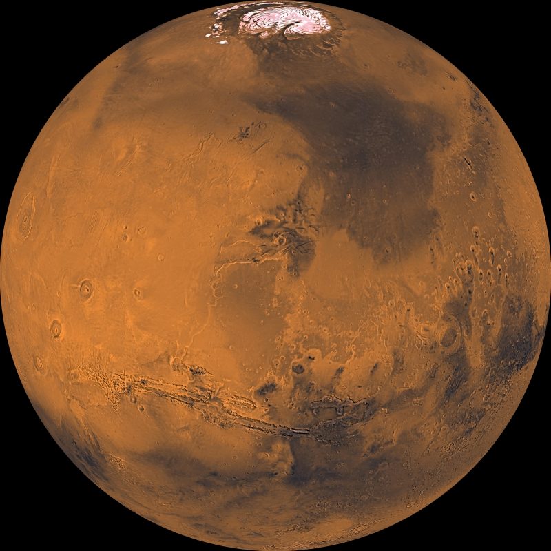 Full-globe, very detailed view of reddish-orange Mars from orbit with polar cap visible.