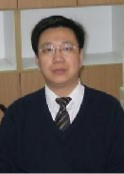 An older Chinese man with glasses, in a sweater and tie.