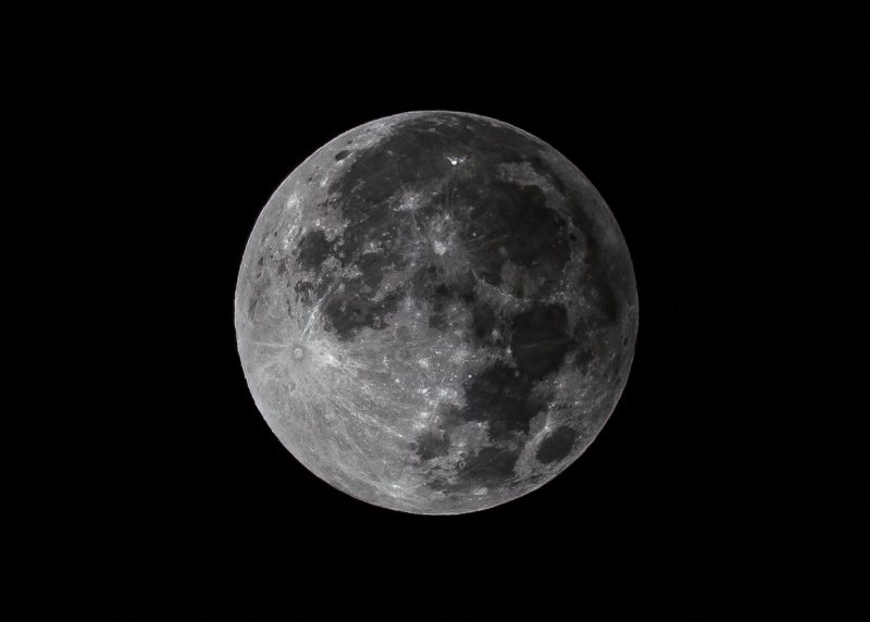 Full moon in penumbral eclipse; there's a shading on one side of the moon.