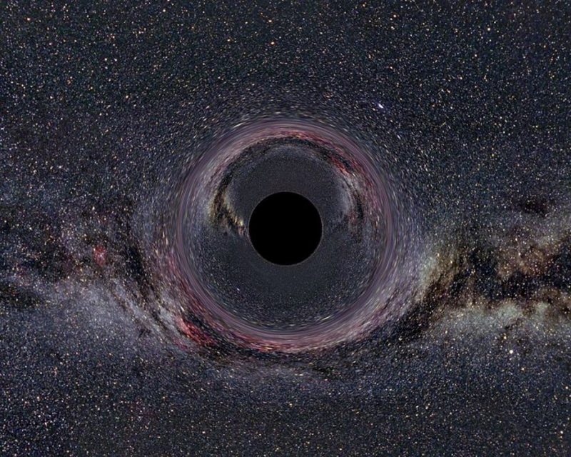 Black circle with thousands of stars in background.
