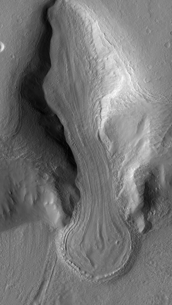 Long grooved tongue-shaped feature in gray-colored terrain.