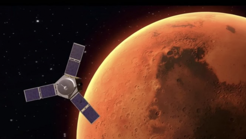 Spacecraft with three solar panel wings above close, red Mars.