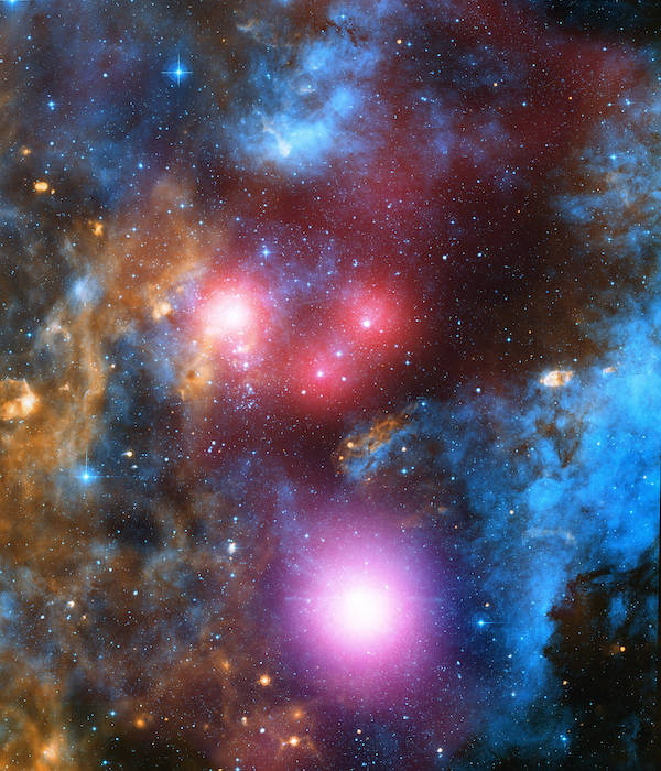 Colorful gas clouds in blue, purple, gold, with bright stars in centers of colored halos.