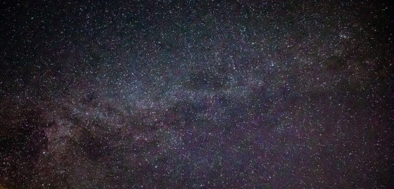 Star field with band of cloudy-looking Milky Way.