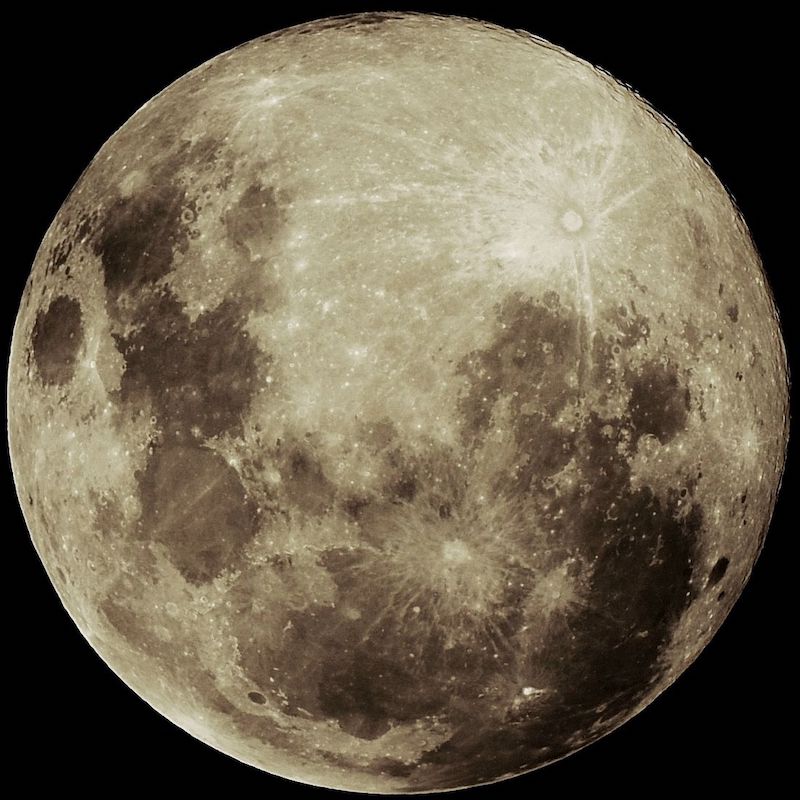 Full moon with enhanced shadows, filling the field of view. 