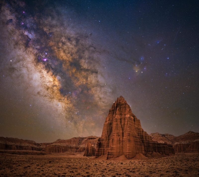 Towering, pointed red rock formation with Milky Way behind it in best Milky Way photos.