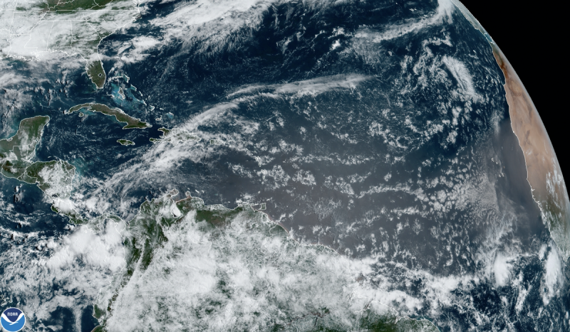 Satellite view of clouds over the Atlantic with west coast of Africa barely visible on right.