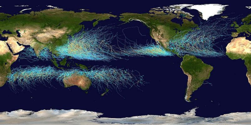 World map with many thin lines in bands above and below equator, which are paths of storms.