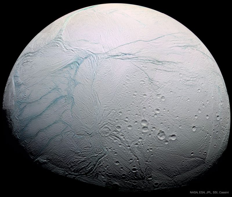 Planet-like white body with bluish cracks and craters.