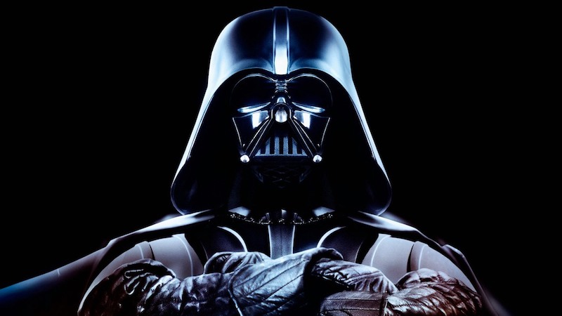 Darth Vader is posed wearing his angular, intimidating, black helmet.