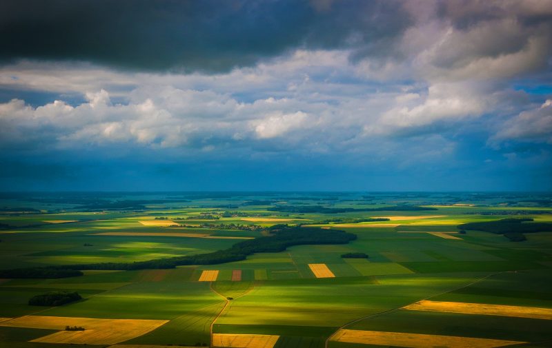 The 2021 IPCC report: View of green and yellow fields from above.