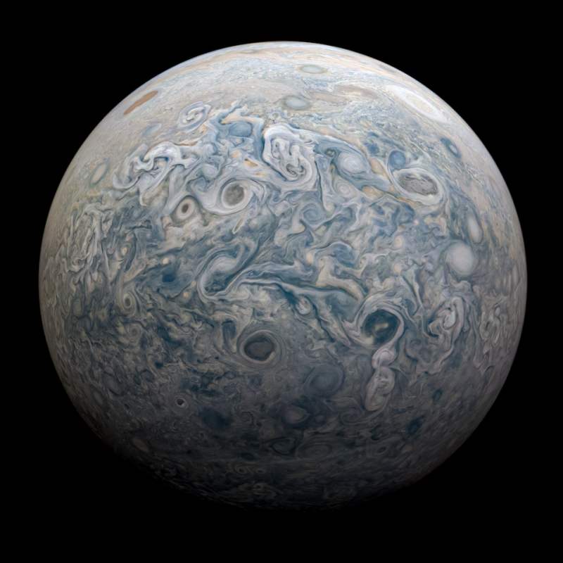 Large planet with many swirls and storms in its atmosphere.