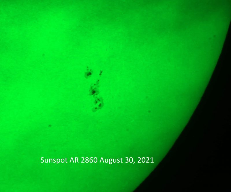 Image of a portion of the sun, showing a large sunspot.