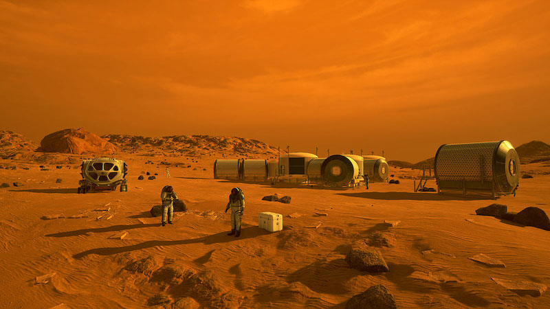 Astronauts, a rover and small cylindrical modular buildings on Mars.